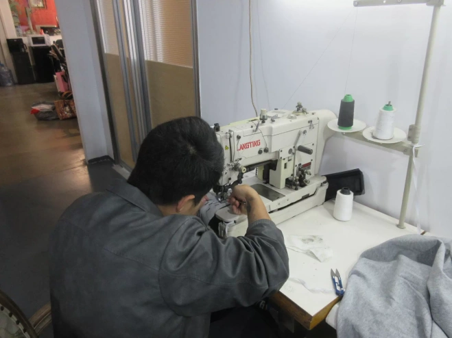 Textile Factory Worker Stitching Fabric For Custom-made Clothing Leather Jacket Manufacturing