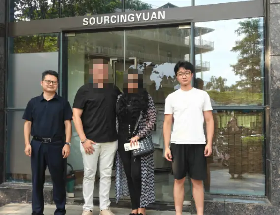 A photo of the Sourcingyuan team with a client