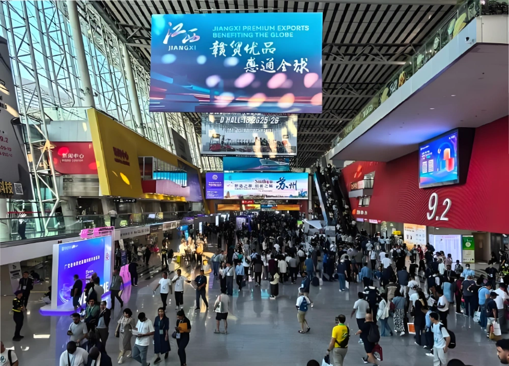 Business scene of buyers walking outside the exhibition hall at the Canton Fair Business scene of buyers walking outside the exhibition hall at the Canton Fair