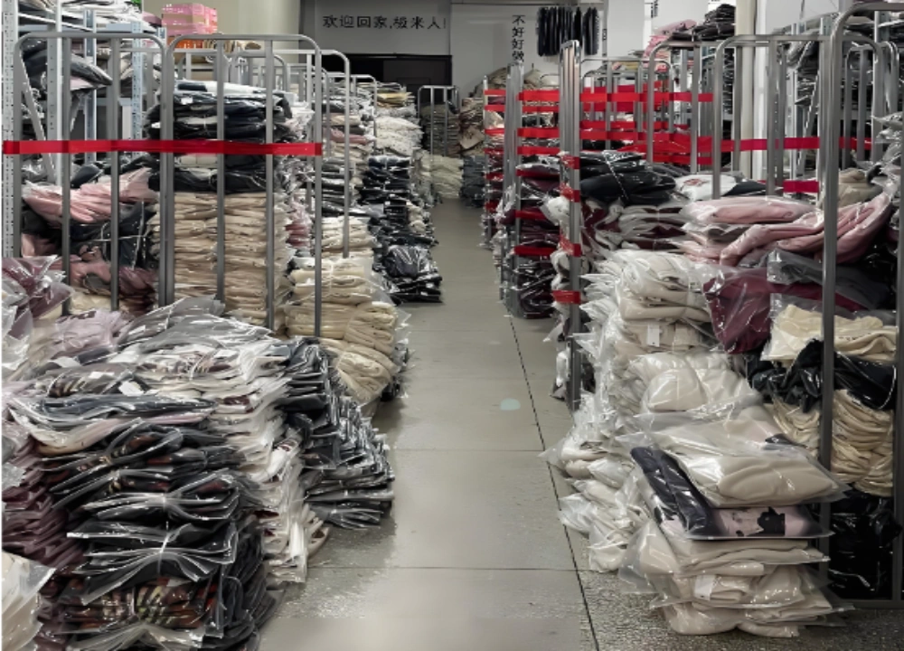 Apparel sourcing factory storage aisle with folded garments Apparel sourcing factory storage aisle with folded garments