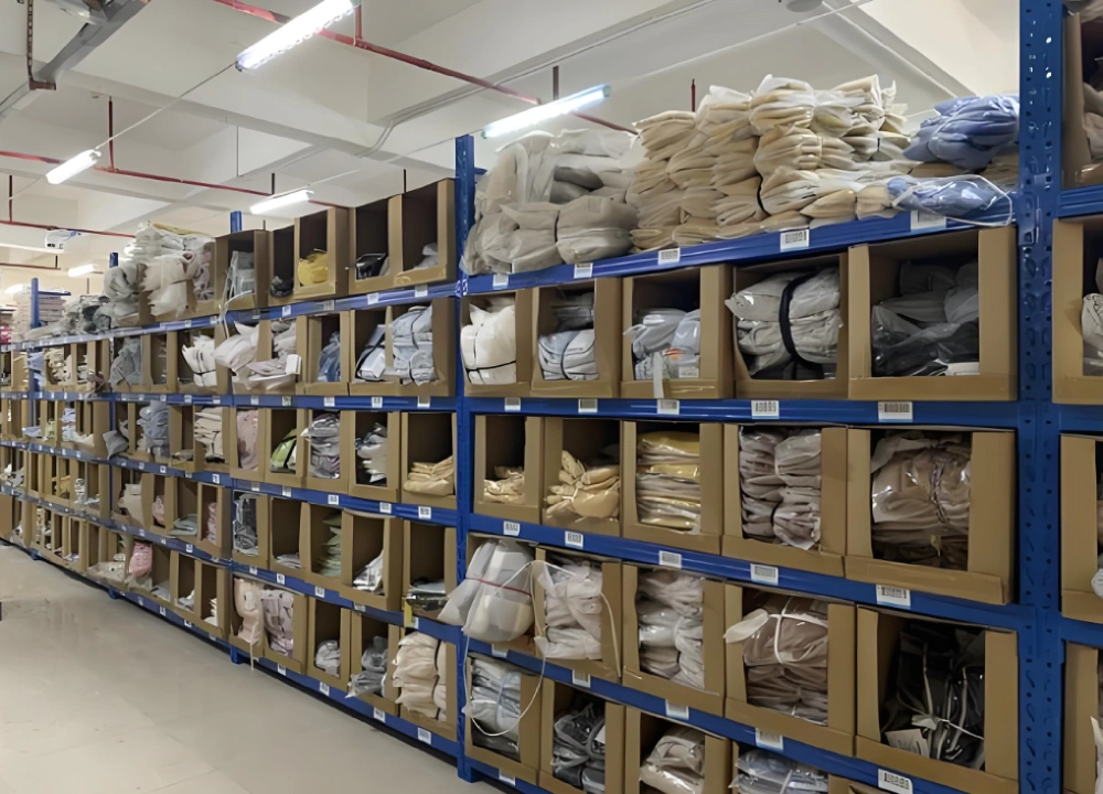 Apparel sourcing warehouse shelving with packed clothing Apparel sourcing warehouse shelving with packed clothing