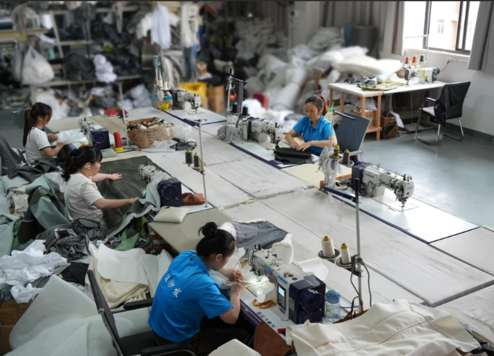 Sewing workshop of a compressed sofa factory